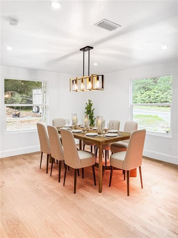 7498 Pinehill Rd, Daphne, AL 36526 - dining space with light wood-style flooring, recessed lighting, and a chandelier