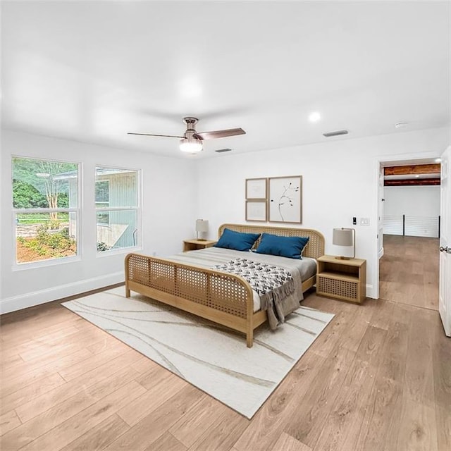 7498 Pinehill Rd, Daphne, AL 36526 - bedroom with wood finished floors and a ceiling fan