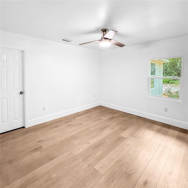 7498 Pinehill Rd, Daphne, AL 36526 - empty room with light wood-style flooring and ceiling fan