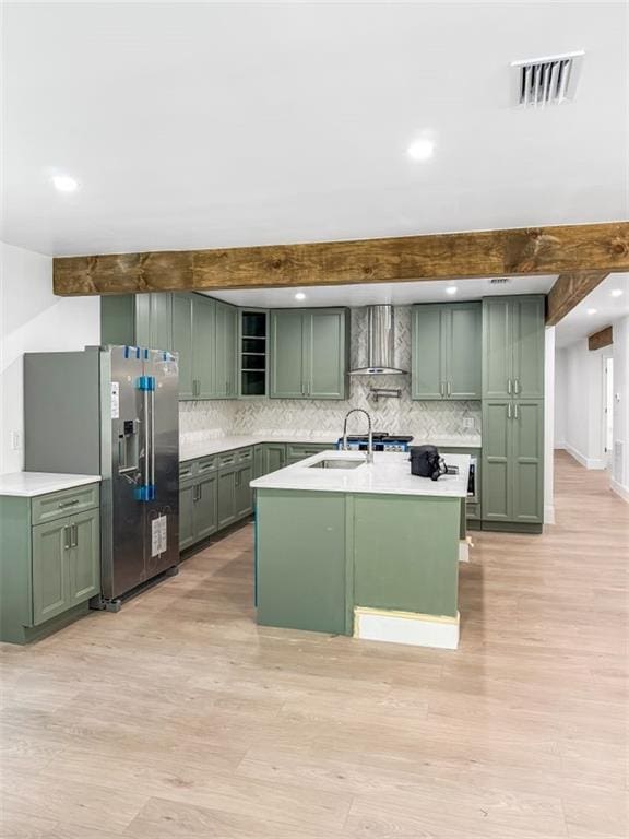 7498 Pinehill Rd, Daphne, AL 36526 - kitchen with green cabinetry, wall chimney exhaust hood, stainless steel fridge, open shelves, and beamed ceiling