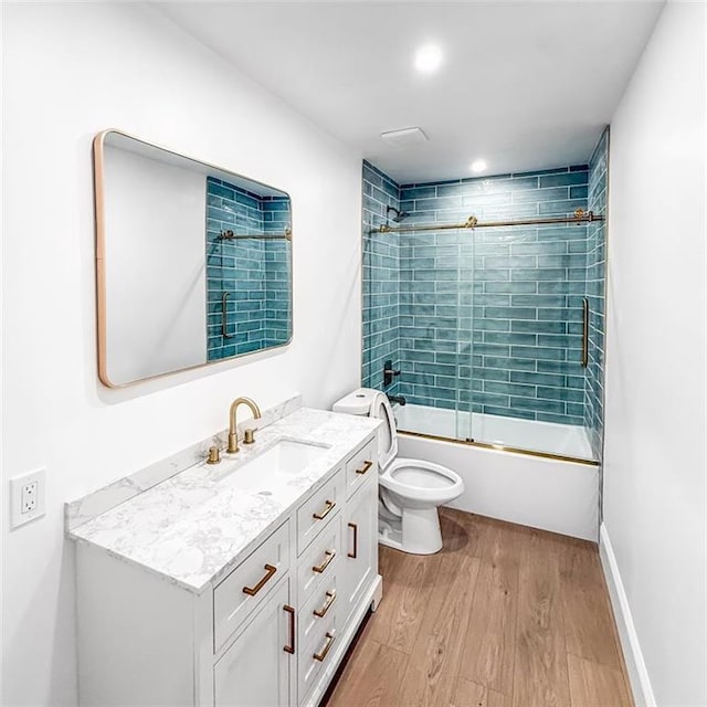 7498 Pinehill Rd, Daphne, AL 36526 - full bath featuring wood finished floors, vanity, and enclosed tub / shower combo