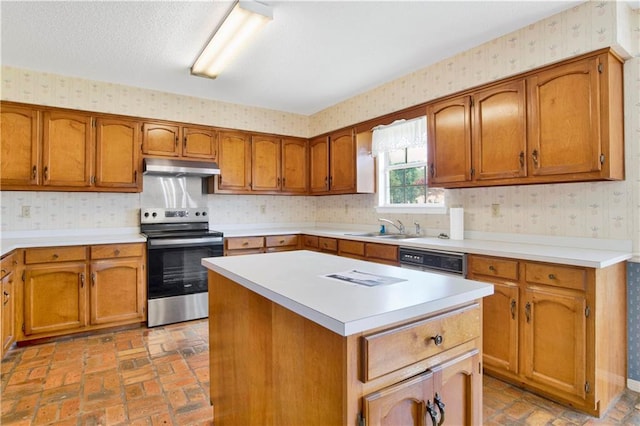 10437 Traci Dr, Semmes, AL 36575 - kitchen featuring brown cabinetry, under cabinet range hood, wallpapered walls, and electric stove