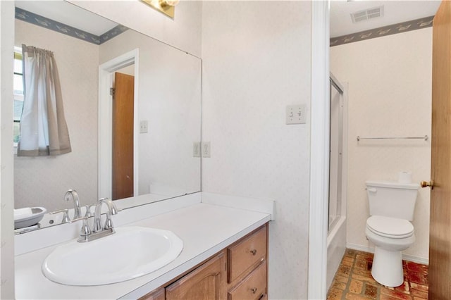 10437 Traci Dr, Semmes, AL 36575 - full bath with toilet, wallpapered walls, visible vents, and vanity