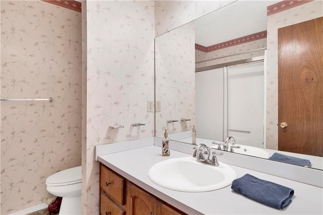 10437 Traci Dr, Semmes, AL 36575 - full bathroom featuring vanity, a shower with shower door, toilet, and wallpapered walls