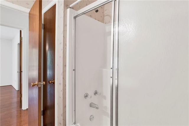 10437 Traci Dr, Semmes, AL 36575 - bathroom with combined bath / shower with glass door and wood finished floors