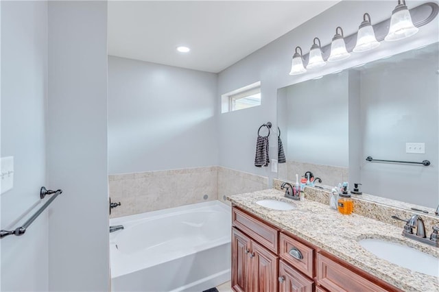 bathroom featuring vanity and a bathtub