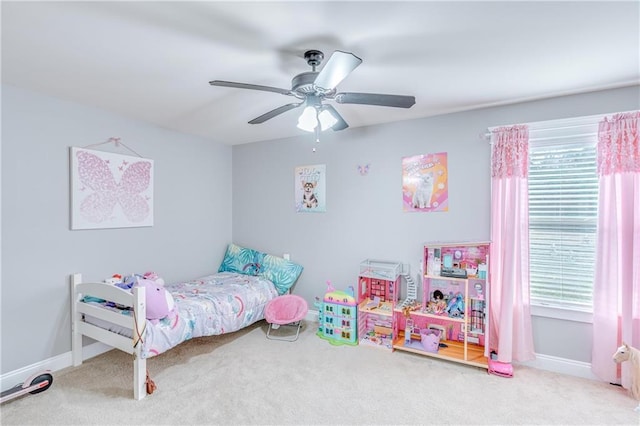 bedroom featuring multiple windows, ceiling fan, and carpet flooring