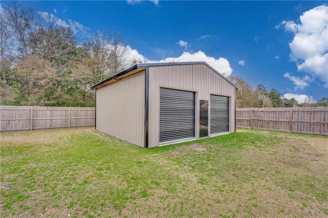 view of outbuilding with a lawn