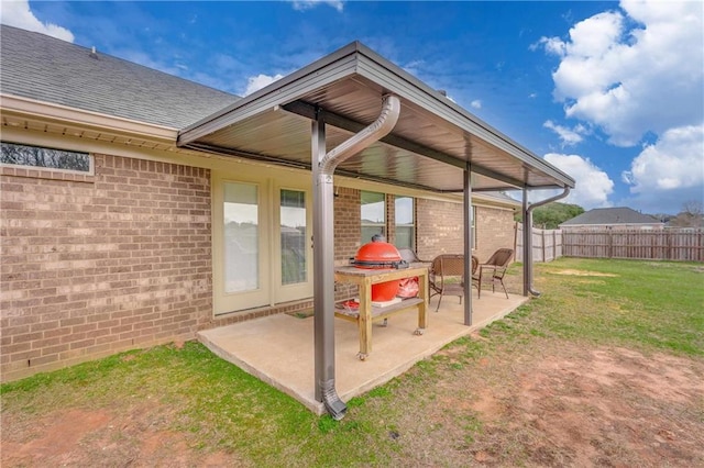 back of house featuring a yard and a patio