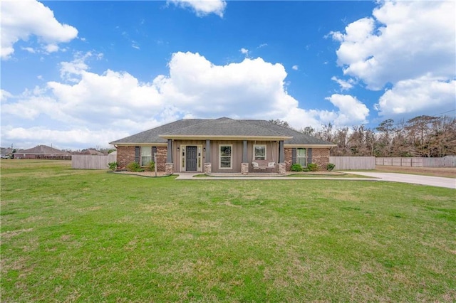 view of front of home with a porch and a front yard