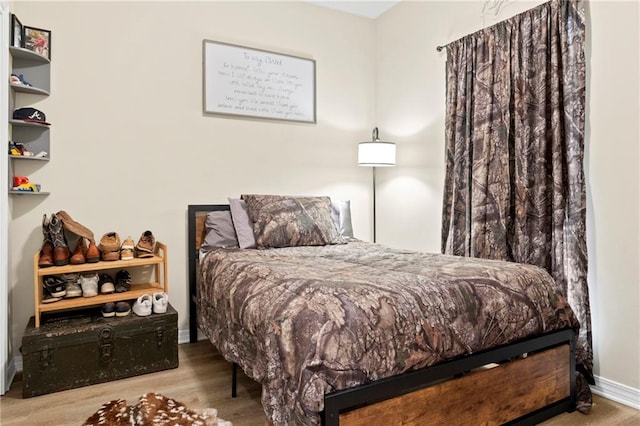 bedroom with wood-type flooring