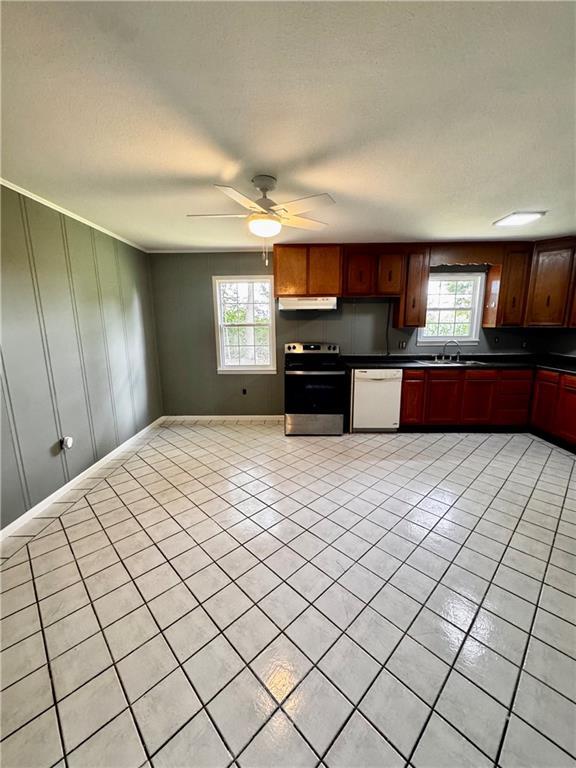 17080A Wayne Johnson Ln, Fairhope, AL 36532 - kitchen featuring stainless steel electric range, dishwasher, dark countertops, a sink, and under cabinet range hood