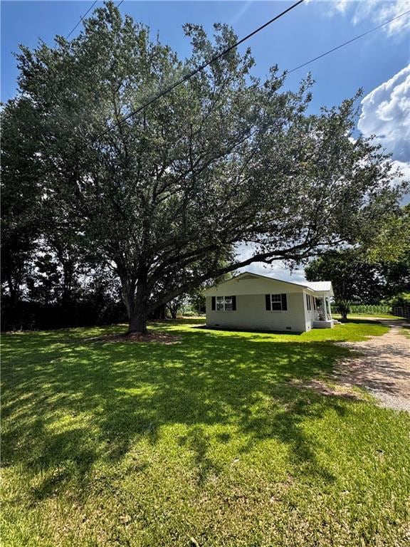 17080A Wayne Johnson Ln, Fairhope, AL 36532 - view of grassy yard featuring dirt driveway