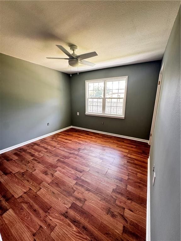 17080A Wayne Johnson Ln, Fairhope, AL 36532 - unfurnished room featuring wood finished floors, ceiling fan, a textured ceiling, and baseboards