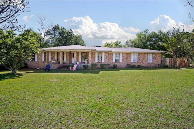 8170 Wilmer Georgetown Rd, Wilmer, AL 36587 - single story home with a front yard, brick siding, and fence