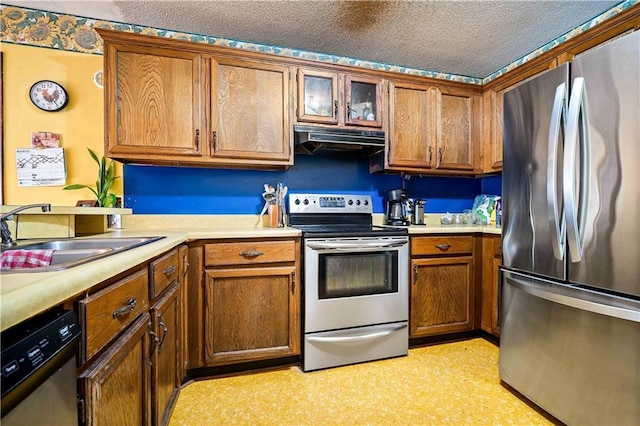 8170 Wilmer Georgetown Rd, Wilmer, AL 36587 - kitchen with brown cabinets, appliances with stainless steel finishes, range hood, and a sink