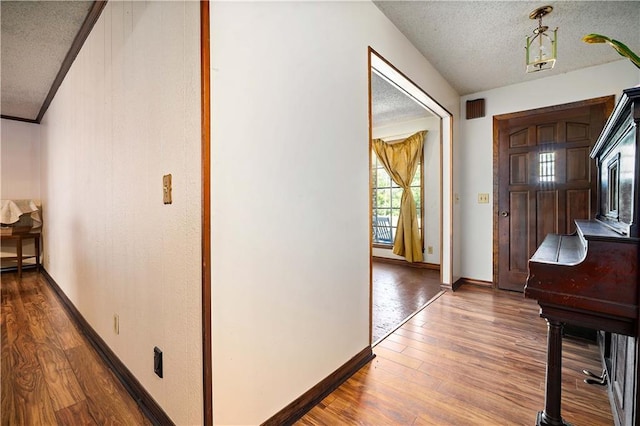 8170 Wilmer Georgetown Rd, Wilmer, AL 36587 - entrance foyer featuring visible vents, baseboards, hardwood / wood-style flooring, and a textured ceiling