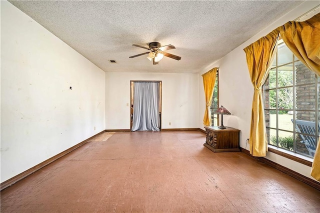 8170 Wilmer Georgetown Rd, Wilmer, AL 36587 - spare room with visible vents, ceiling fan, baseboards, and a textured ceiling