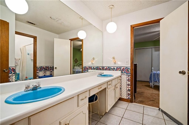 8170 Wilmer Georgetown Rd, Wilmer, AL 36587 - full bathroom featuring tile patterned floors, double vanity, a sink, and visible vents