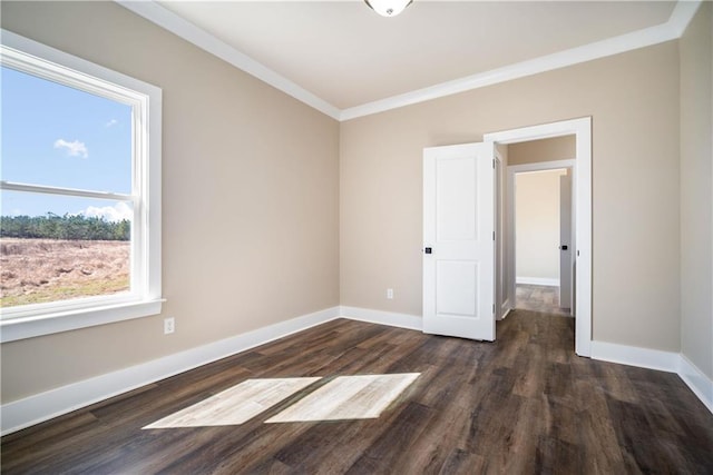 unfurnished room with crown molding and dark hardwood / wood-style floors