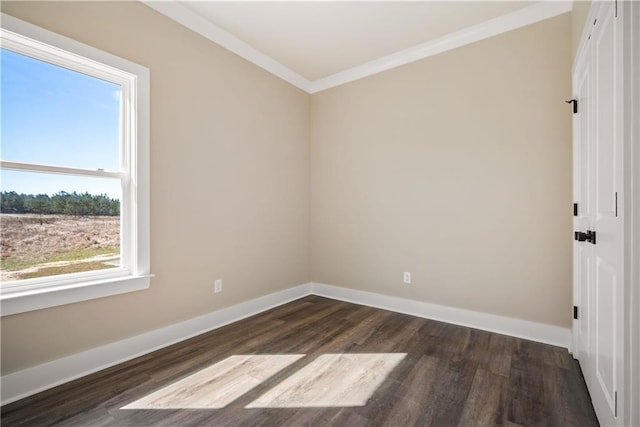 spare room with crown molding and dark hardwood / wood-style floors