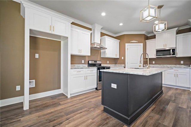 kitchen featuring stainless steel appliances, light stone countertops, white cabinets, and wall chimney range hood