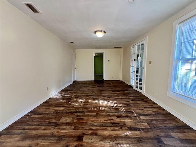 unfurnished room with french doors and dark hardwood / wood-style floors