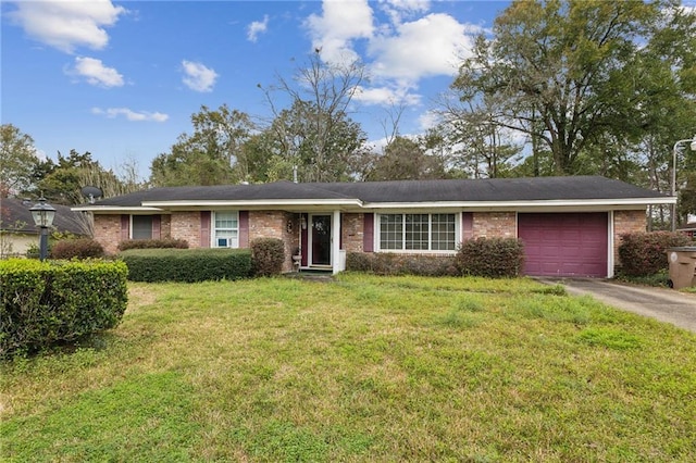 ranch-style house featuring a front lawn, an attached garage, brick siding, and driveway