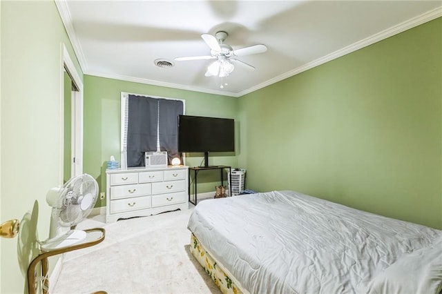 bedroom with visible vents, a ceiling fan, a closet, carpet flooring, and crown molding