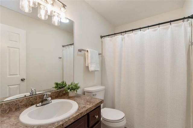 full bath featuring vanity and toilet