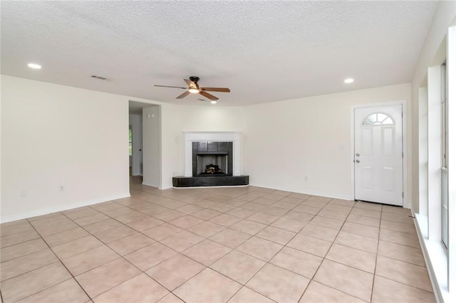 unfurnished living room featuring visible vents, ceiling fan, recessed lighting, and a textured ceiling
