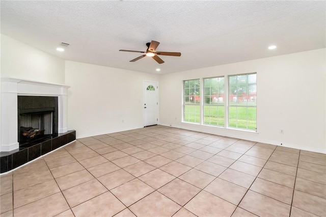 unfurnished living room with baseboards, recessed lighting, a textured ceiling, a ceiling fan, and visible vents