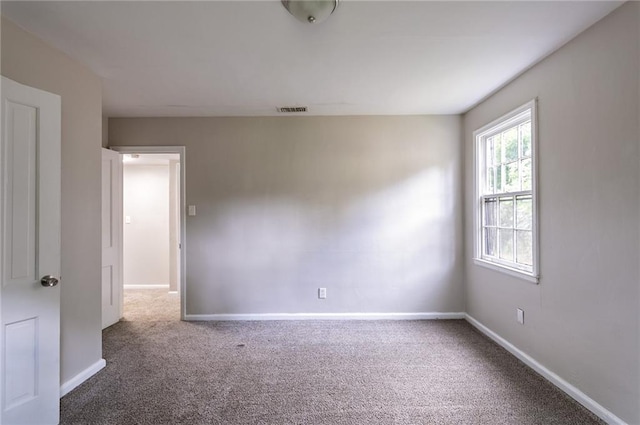 spare room with carpet flooring