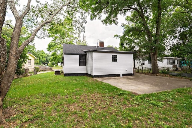 back of house with a yard