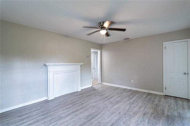 unfurnished room featuring ceiling fan and wood-type flooring