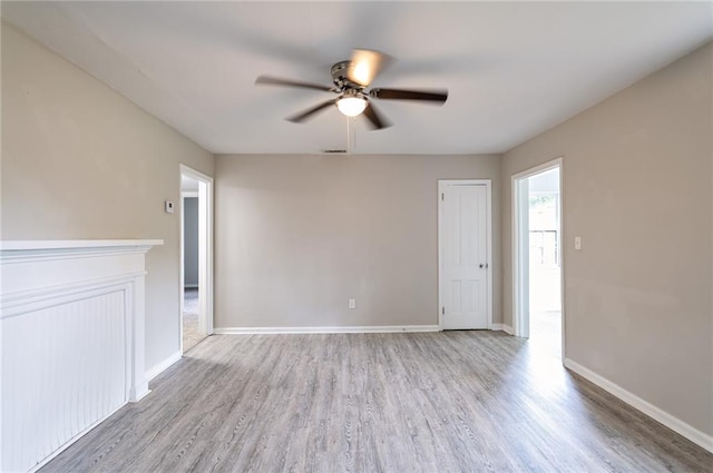 unfurnished room with ceiling fan and light wood-type flooring