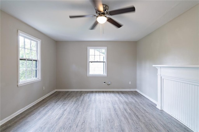 spare room featuring hardwood / wood-style flooring and ceiling fan