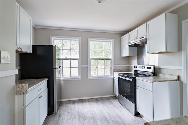 kitchen with white cabinets, light hardwood / wood-style flooring, light stone counters, and stainless steel range with electric stovetop