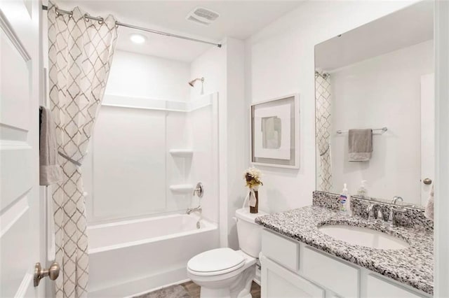 full bathroom with vanity, toilet, and shower / tub combo