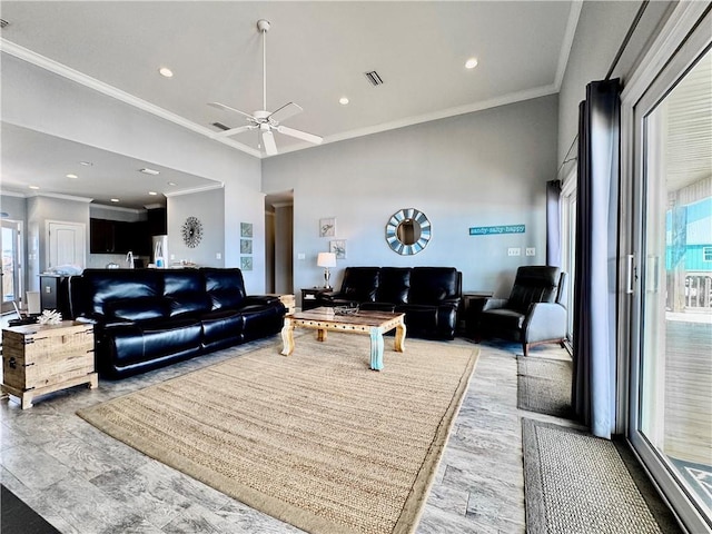 living room with crown molding, recessed lighting, visible vents, and ceiling fan