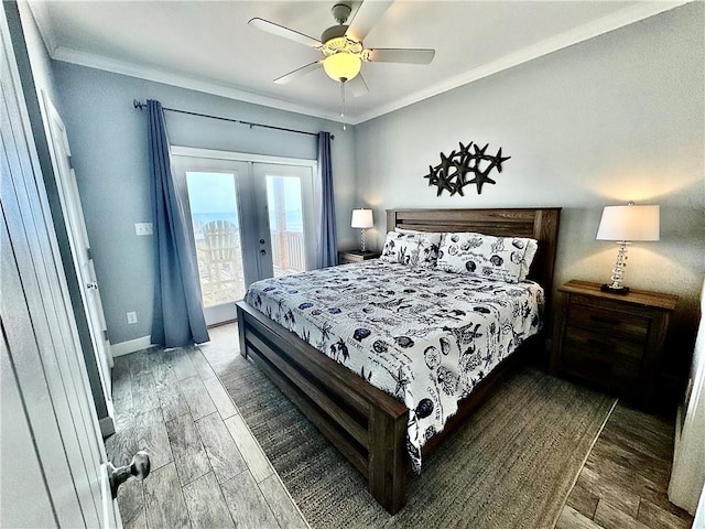 bedroom featuring wood finished floors, french doors, crown molding, baseboards, and access to exterior