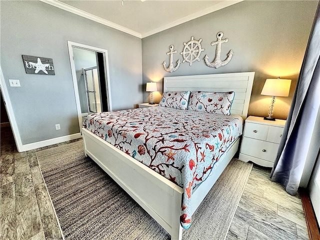 bedroom with crown molding, baseboards, and wood finished floors