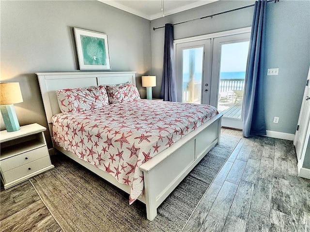 bedroom featuring wood finished floors, baseboards, ornamental molding, access to exterior, and french doors