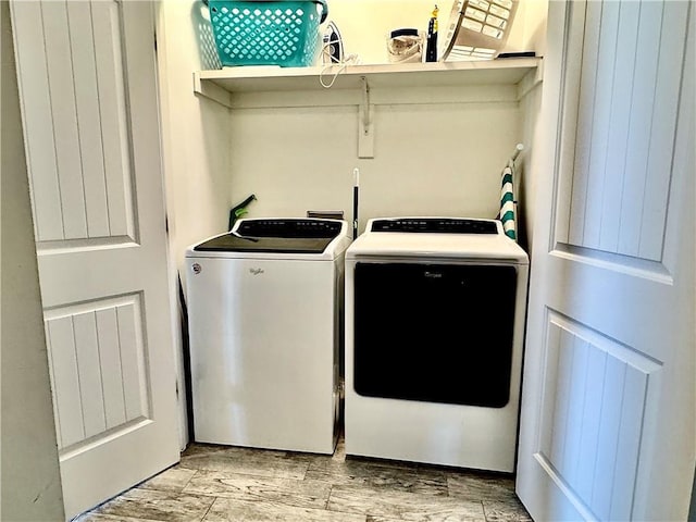 clothes washing area featuring laundry area and separate washer and dryer