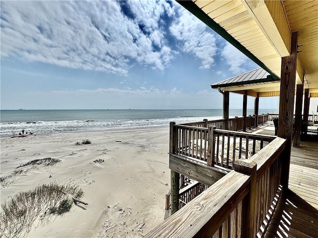 view of community with a view of the beach and a water view