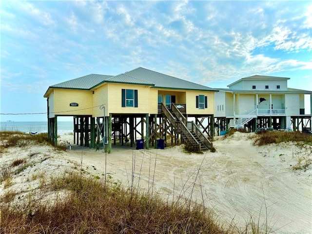 exterior space with stairs and a carport