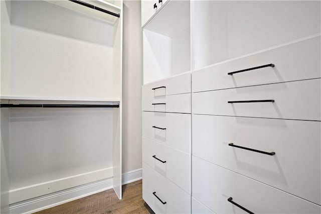 spacious closet with wood finished floors