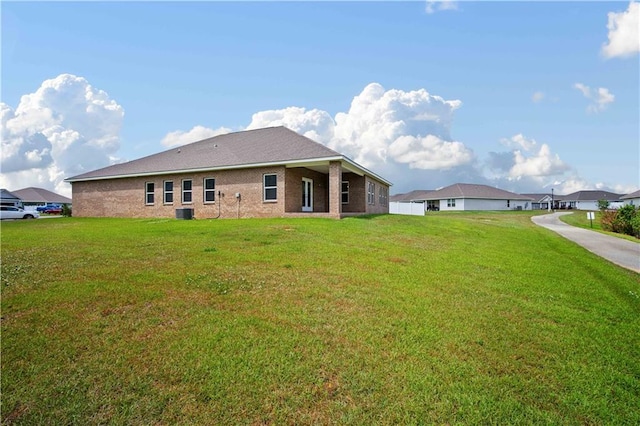 back of property with a yard