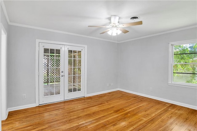 1215 Anchor Dr, Mobile, AL 36693 - spare room with light wood-style flooring, french doors, baseboards, ceiling fan, and ornamental molding