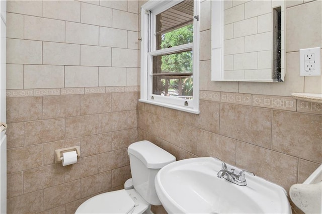 1215 Anchor Dr, Mobile, AL 36693 - half bathroom with tile walls, toilet, and a sink